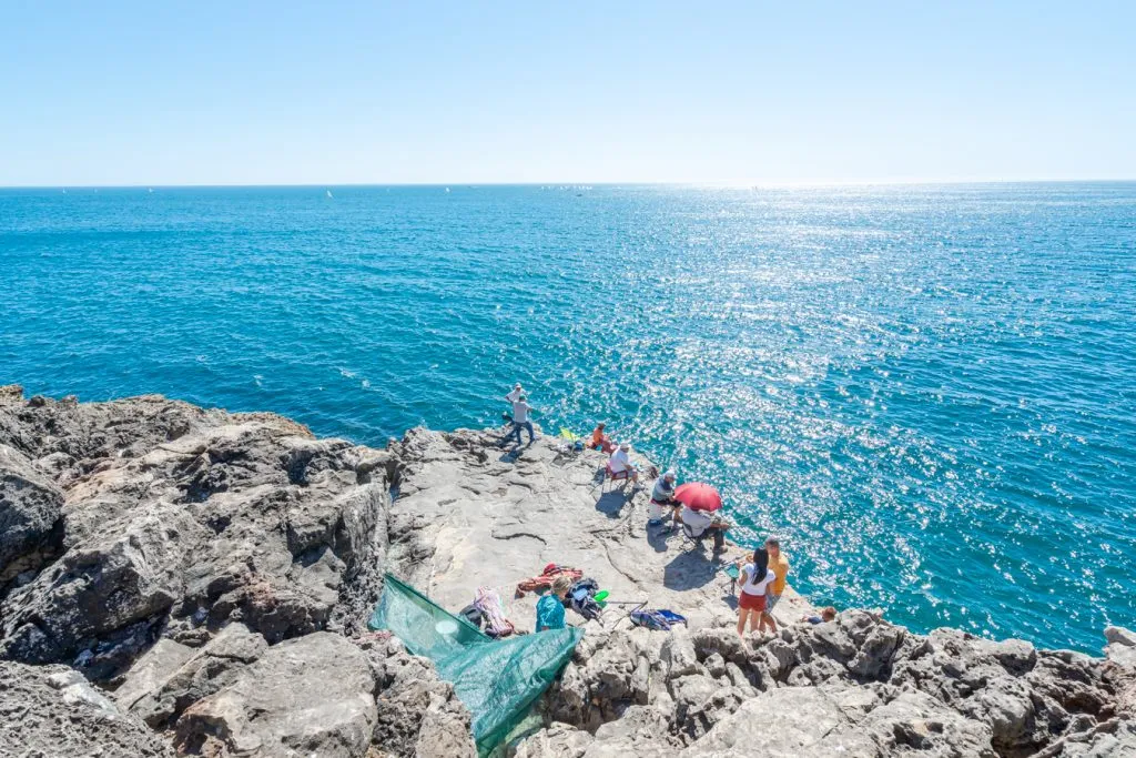 fishermen near boca do inferno as seen when visiting cascais on a lisbon to cascais day trip