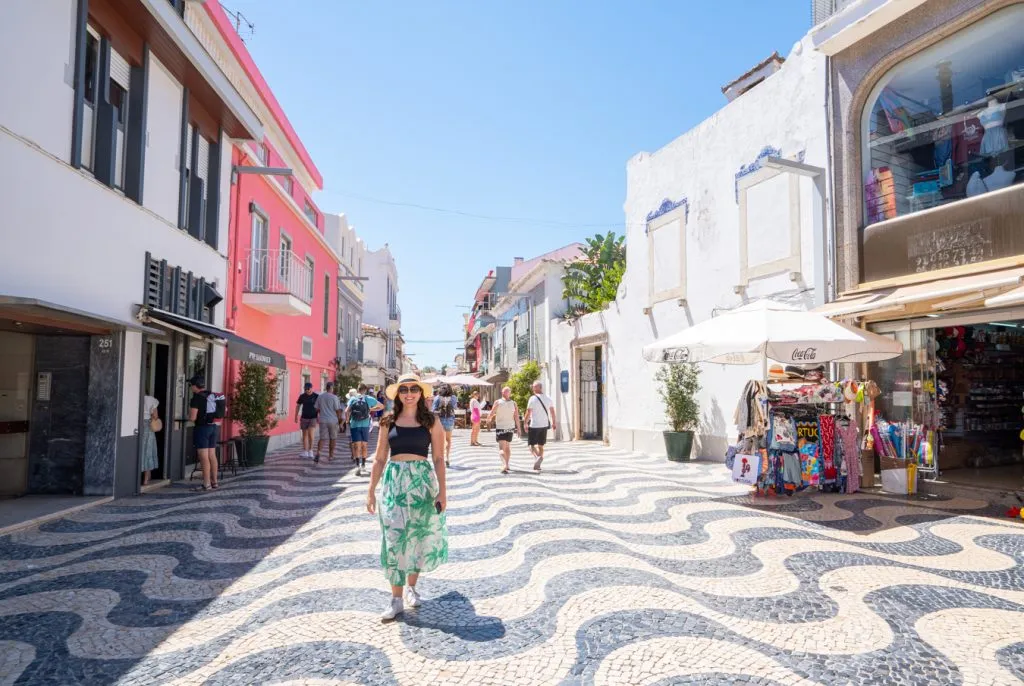 kate storm walking across wavy portuguese pavement in cascais, a fun addition to an itinerary portugal 10 days