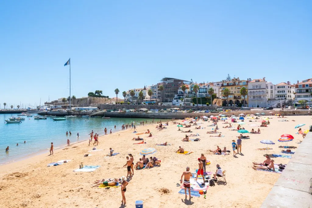 crowded beach in cascais portugal on a sunny day