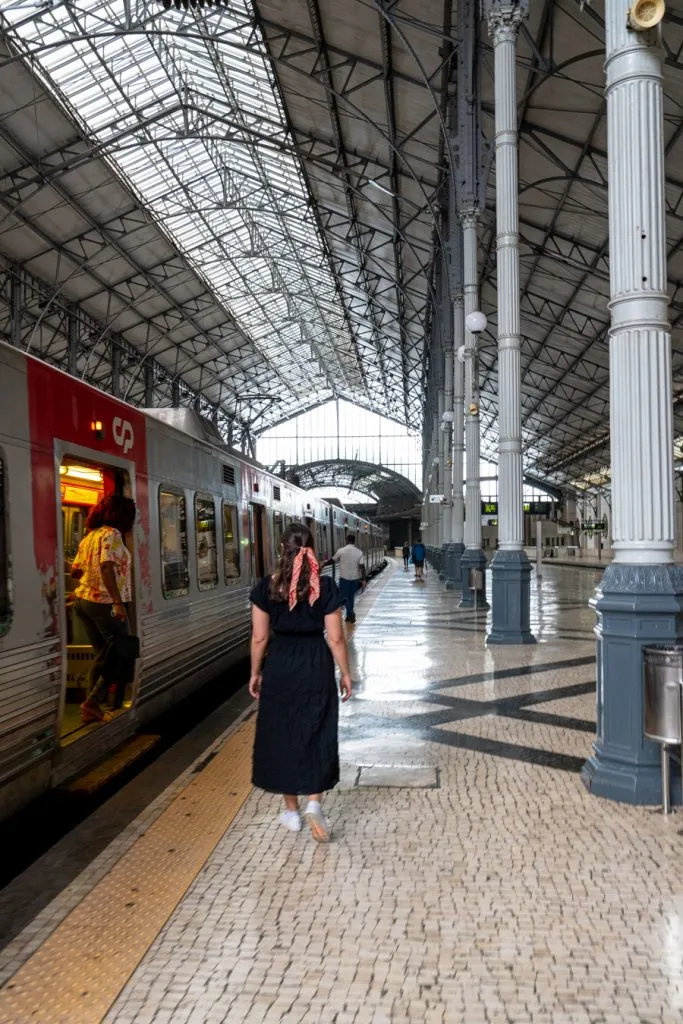 kate storm boarding a train to sintra from lisbon portugal