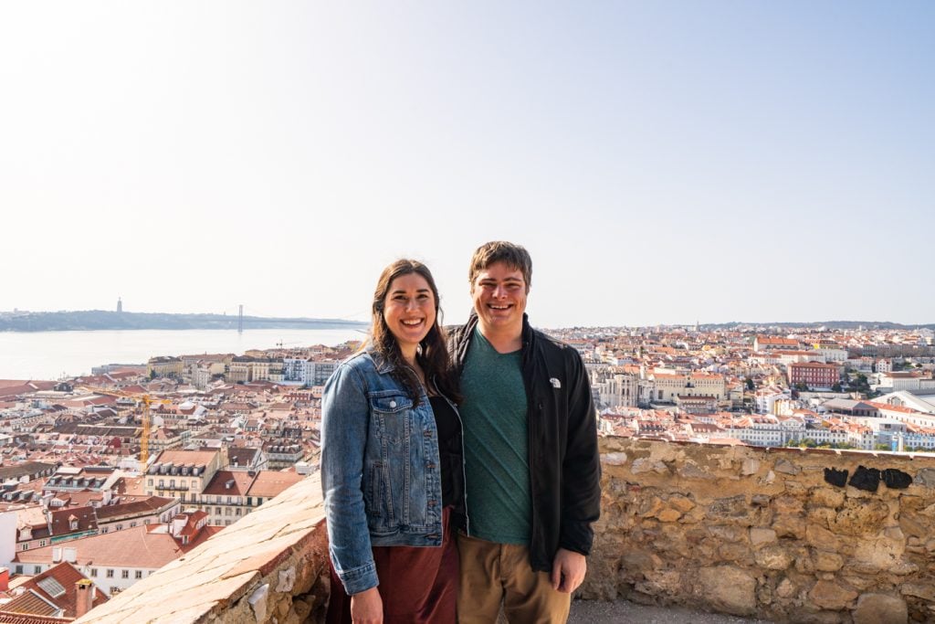 kate storm and jeremy storm during winter in lisbon portugal standing on the walls of castelo de sao jorge