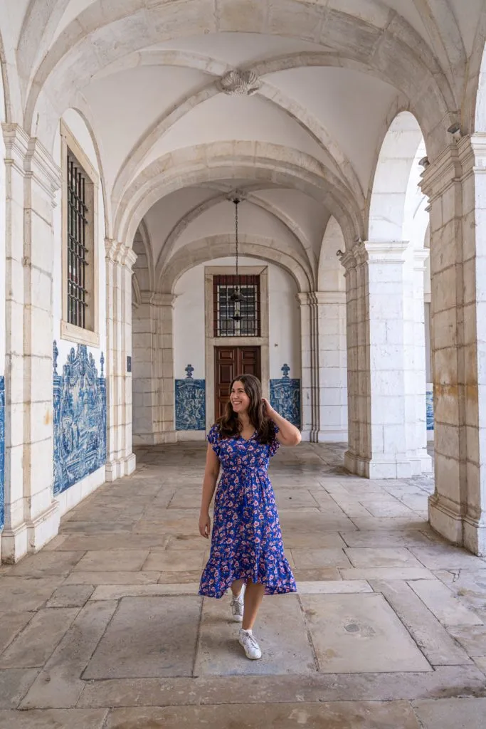kate storm in a blue dress in the monastery of sao vicente, one of the best places in lisbon off the beaten path