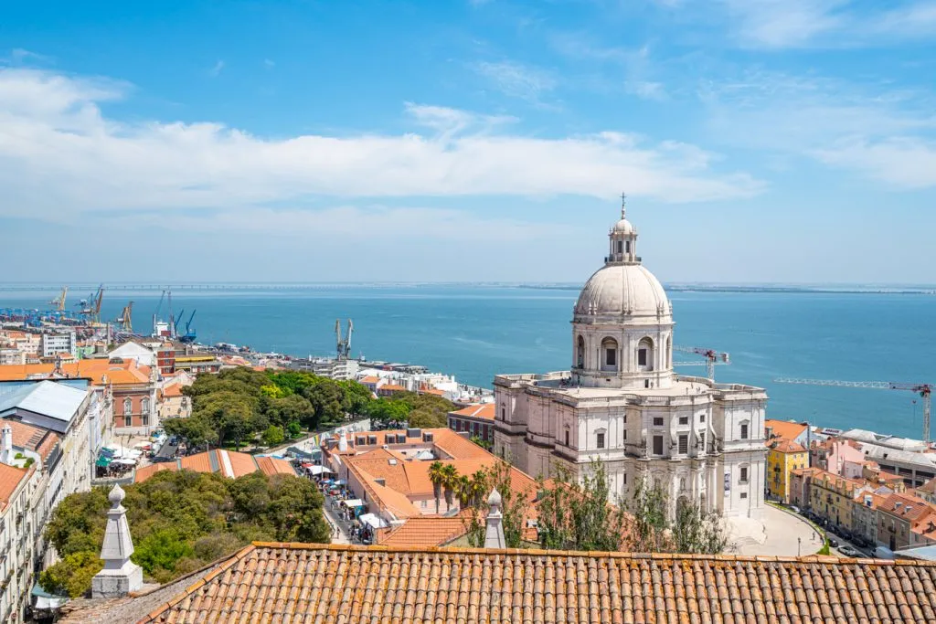 view of the lisbon national pantheon from above with tagus river behind it