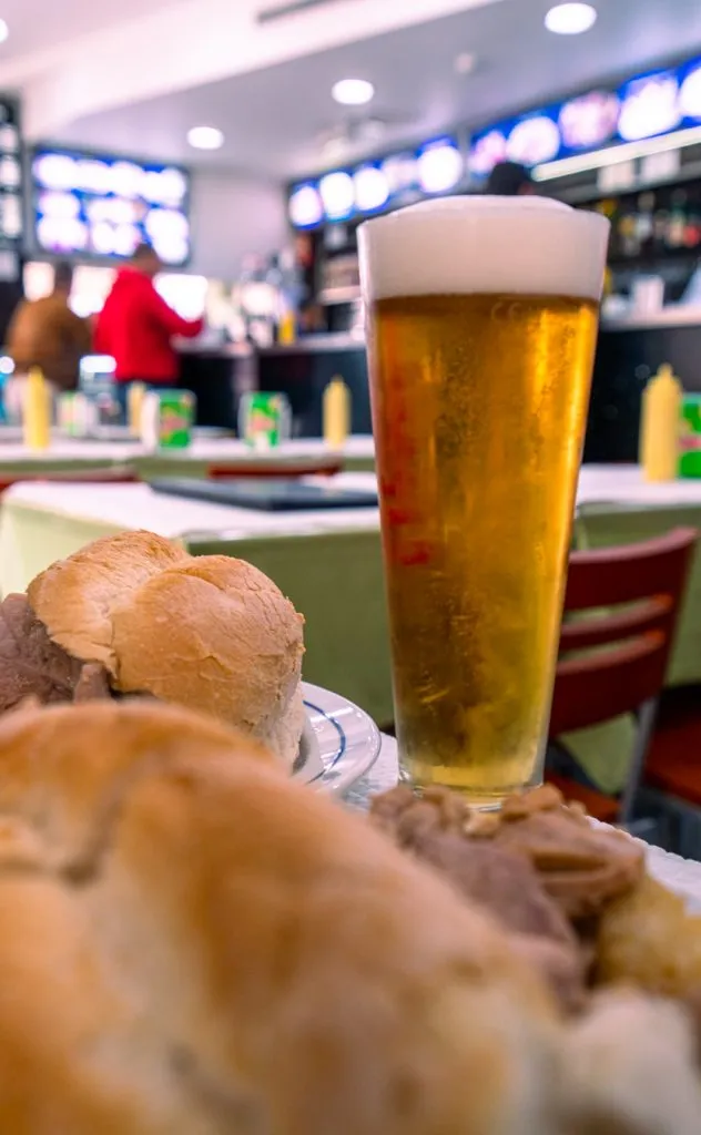 bifana and beer on a table in a snack bar in lisbon portugal
