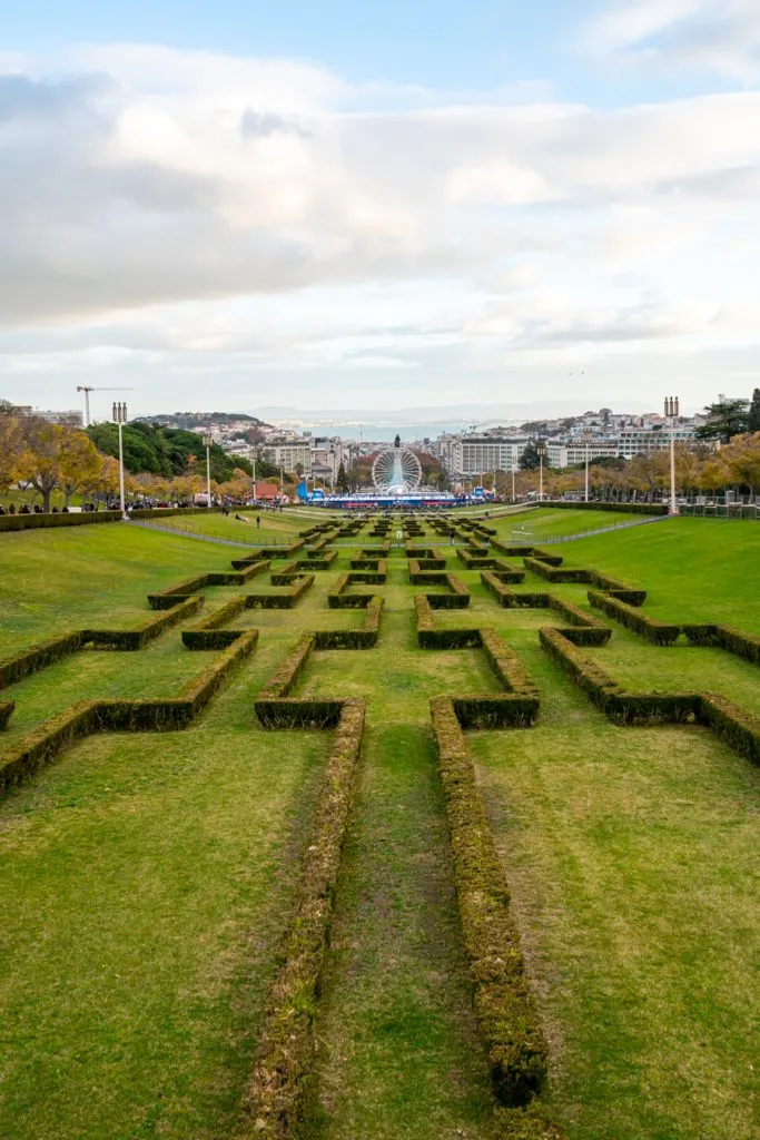 view of lisbon portugal from the top of parque eduardo vii, with wonderland lisboa winter festival visible in the distance