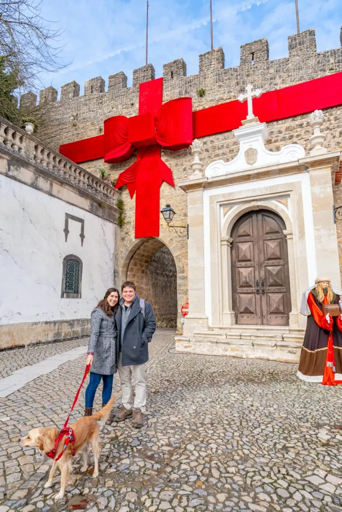 kate storm jeremy storm and ranger storm in front of the obidos castle during december in portugal