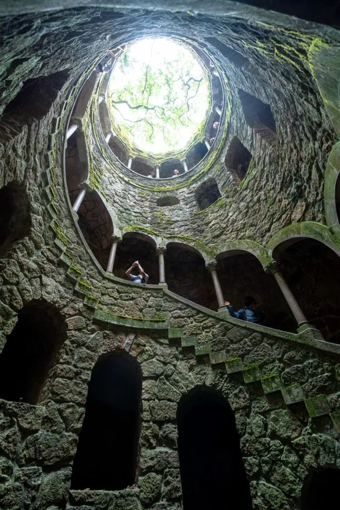 famous well of sintra portugal shot from the inside looking up