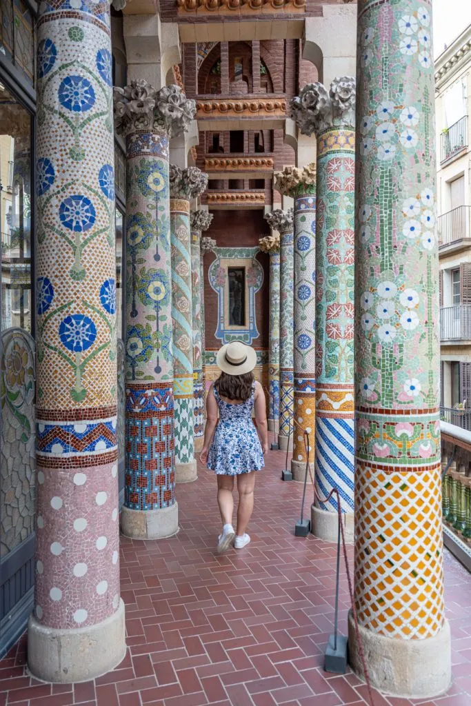 kate storm in a blue dress on the deck of the palace of catalan music in barcelona spain