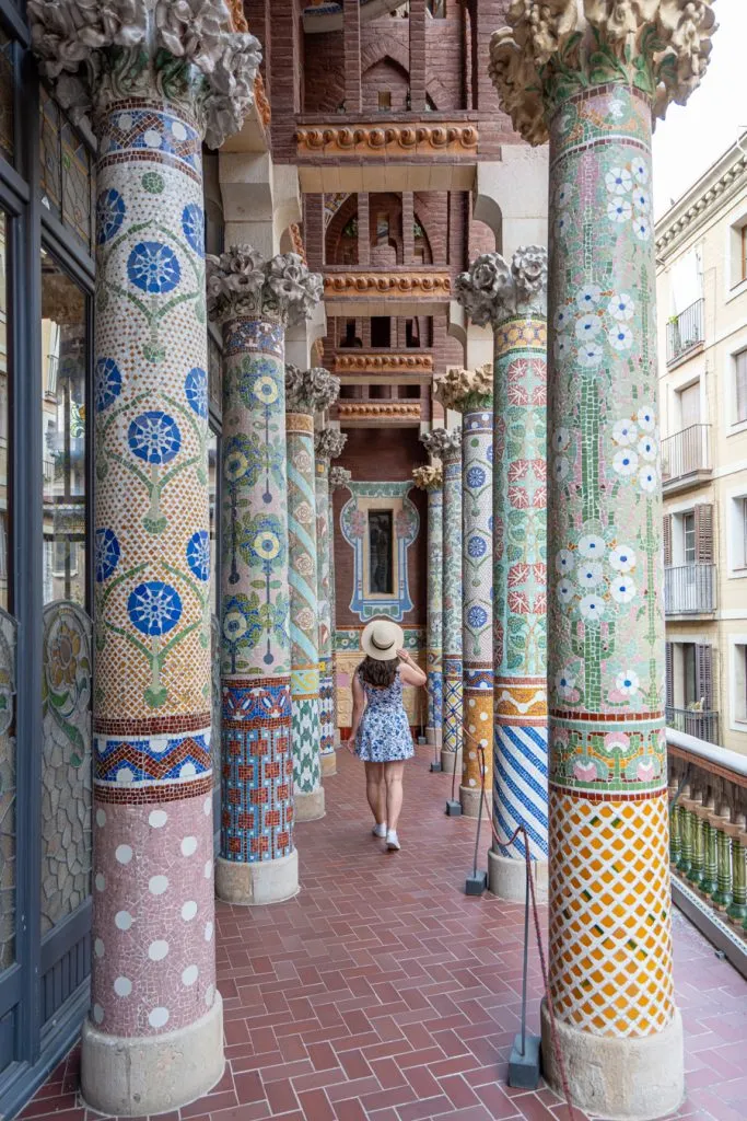 kate storm walking through the columns of the balcony at the barcelona opera house