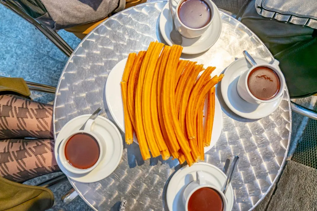 pile of churros con chocolate at Chocolatería San Ginés one night in madrid spain