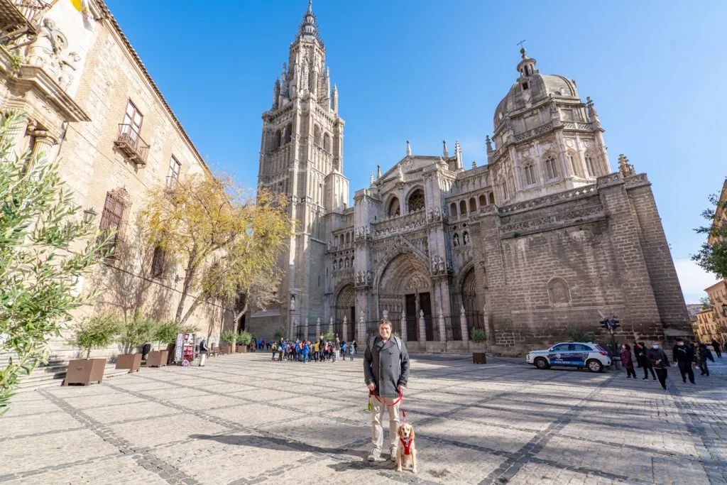 jeremy storm and ranger storm standing in front of the toledo cathedral, one of the best places to visit on a day trip to toledo from madrid