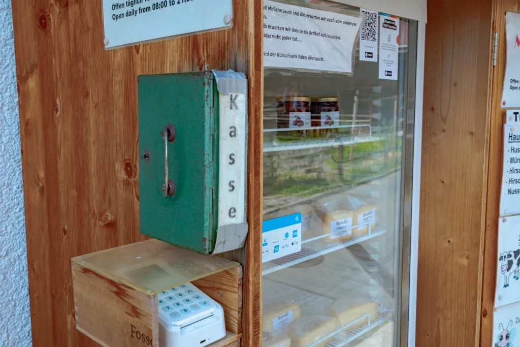 honesty fridge in switzerland selling cheese and sausage with credit card machine