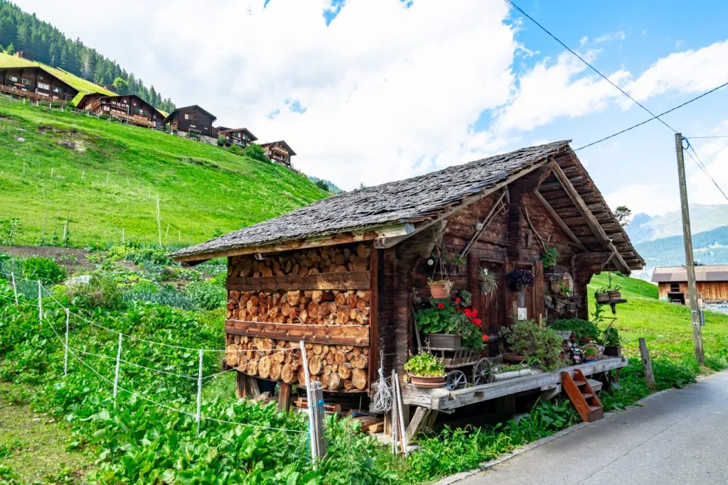swiss chalet with flower boxes as seen when visiting gimmelwald switzerland