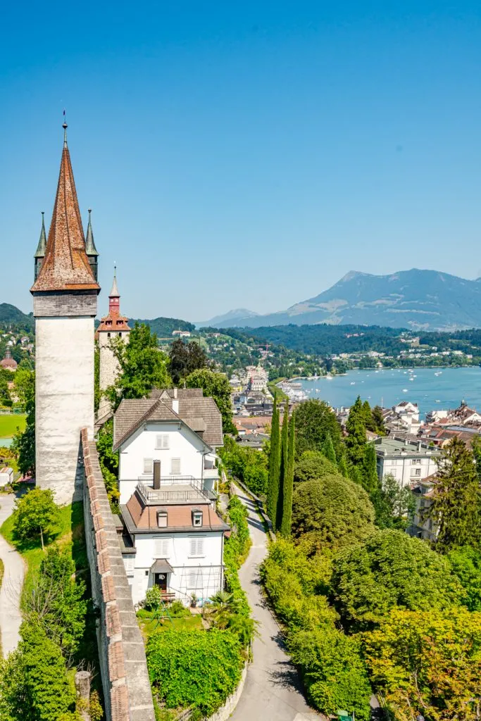 view of tower and lake lucerne from musegg walls, one of the best things to do in lucerne