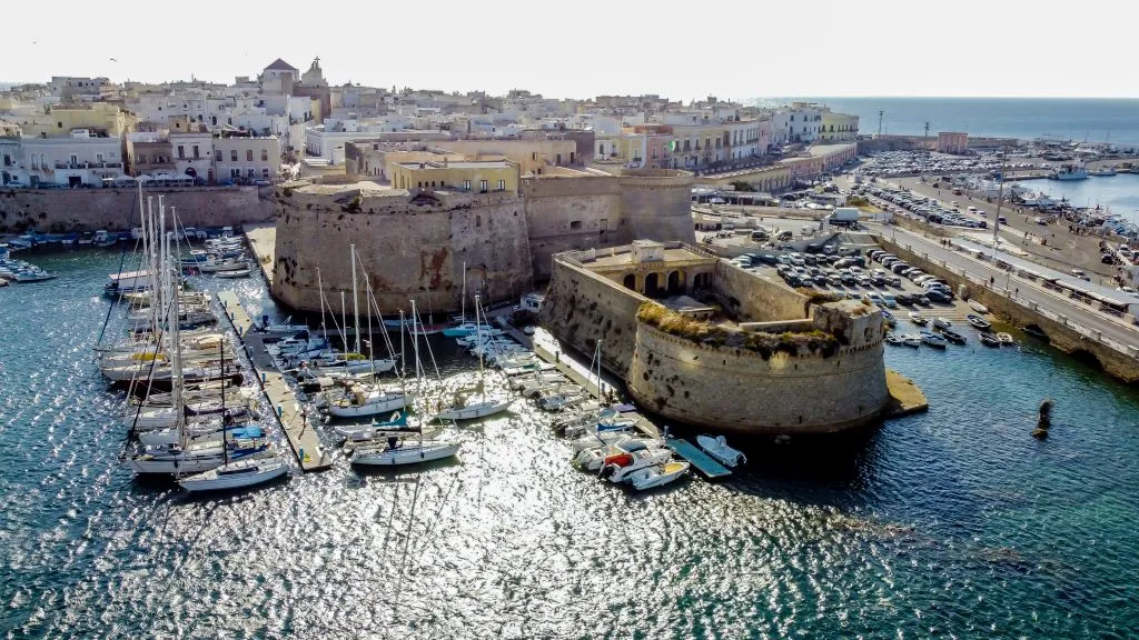 aerial view of gallipoli castle walls and harbor, one of the best places in puglia italy to visit