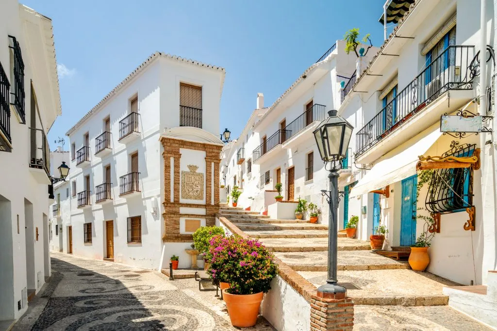 whitewashed buildings in the center of nerja, one of the most beautiful coastal towns in spain