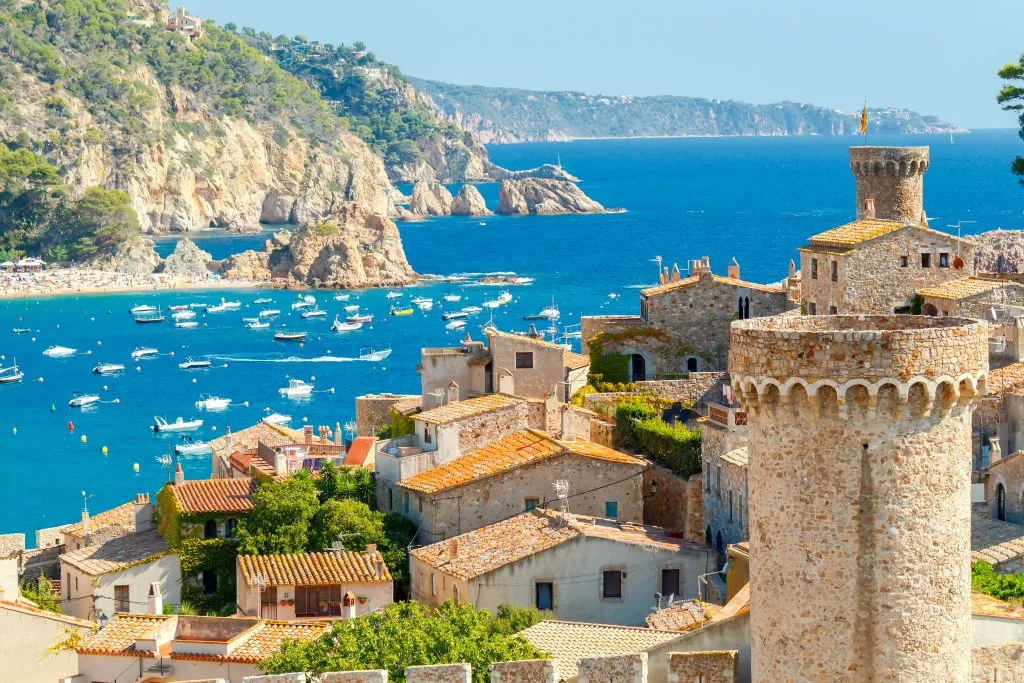 tossa de mar, costa brava, from above, with castle in the foreground and water in the background, one of the best beach towns in spain