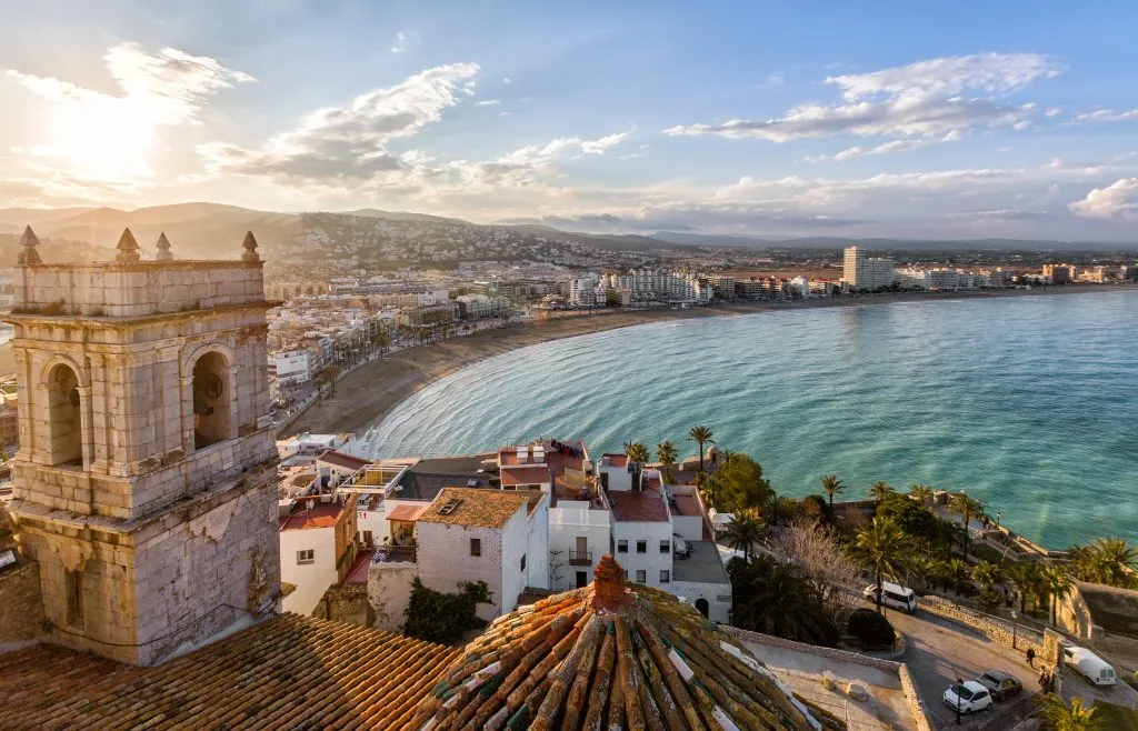 view of valencia spain from above with a tower in the foreground and spanish beach in the background