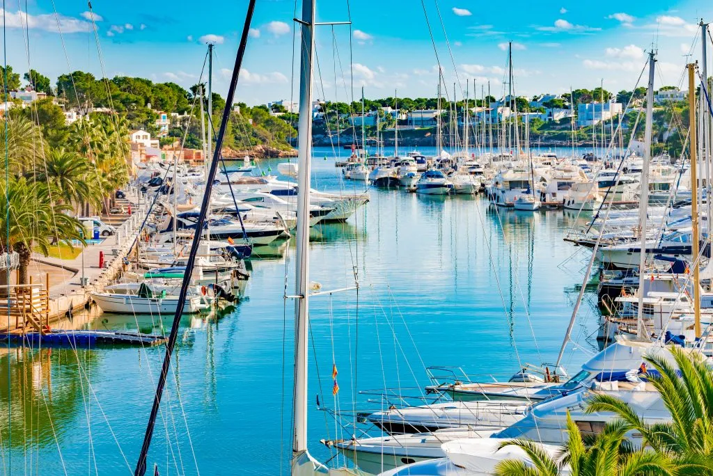 sailboats parked in cala d'or marina in one of the best spain coastal towns