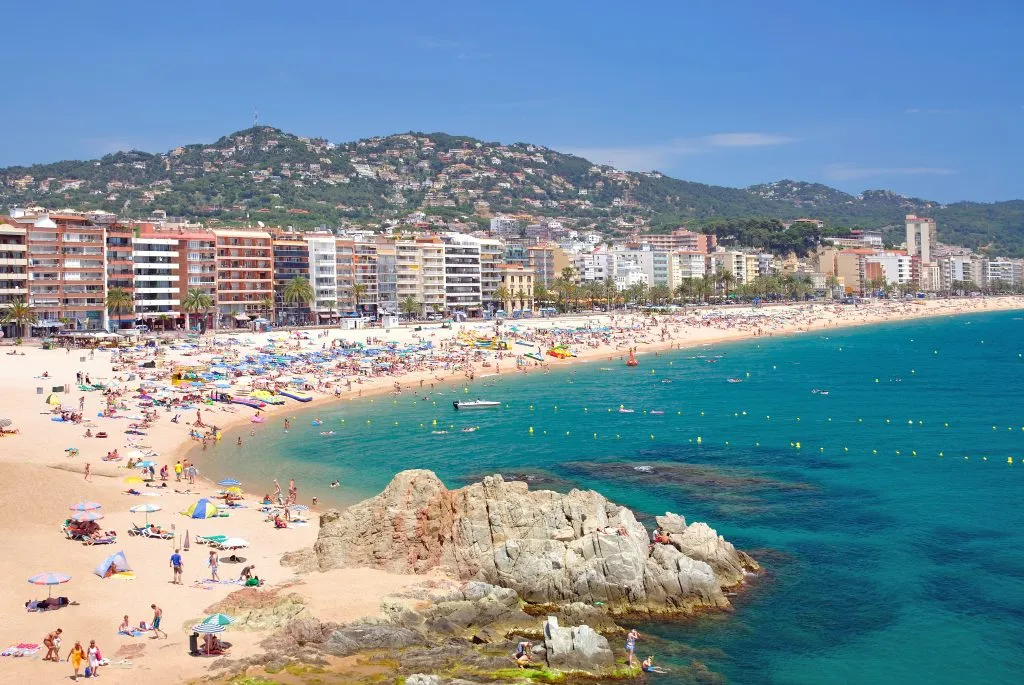 lloret de mar spain as seen from the water with beach in the foreground