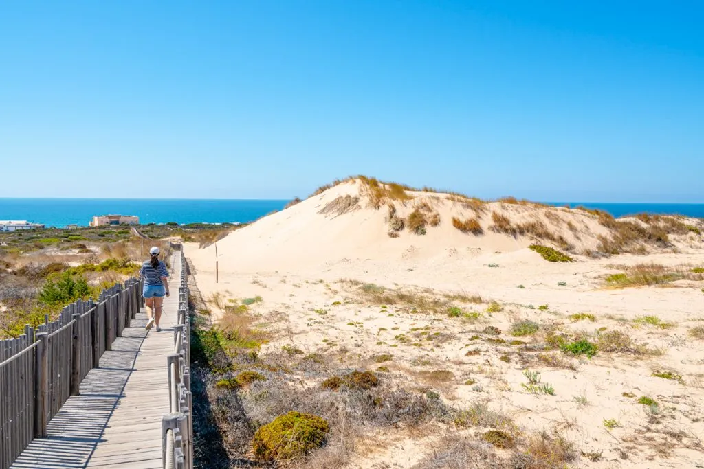 kate storm and ranger storm on a boardwalk at the cresmina dunes near lisbon