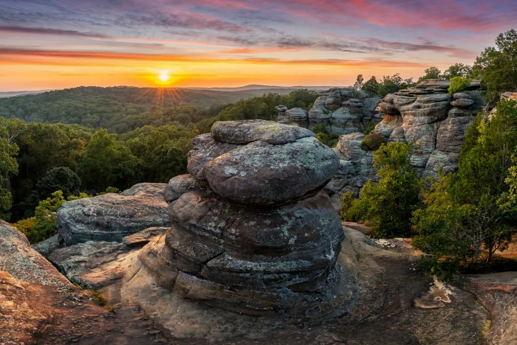 sunset over rock formations in garden of the gods illinois, a fun usa midwest road trip destination