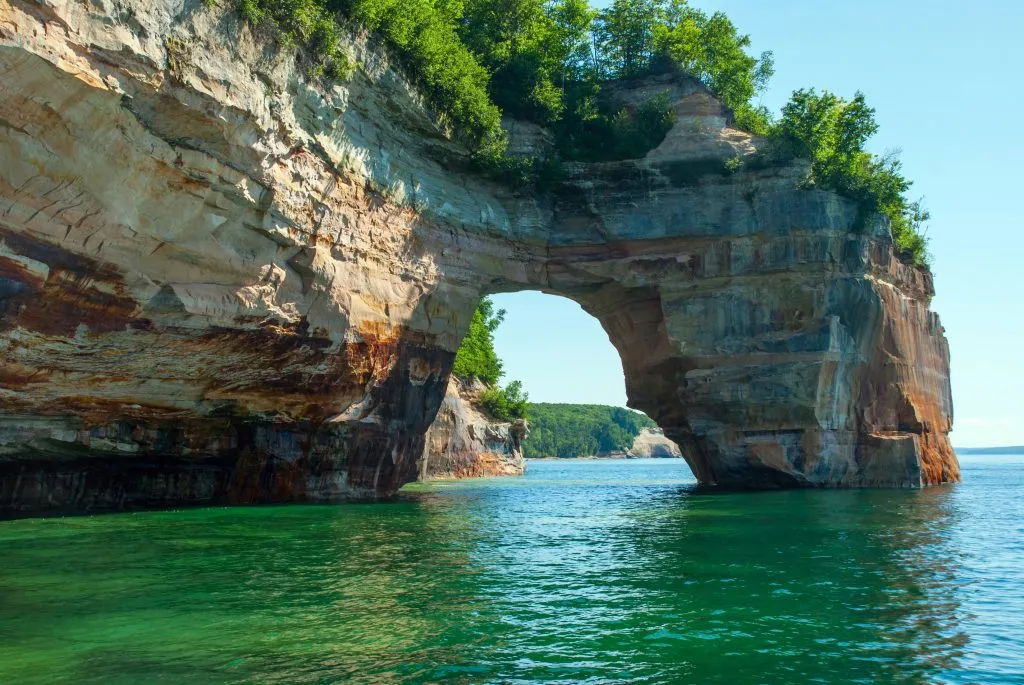 arch at pictured rocks national lakeshore, one of the best midwest travel destinations