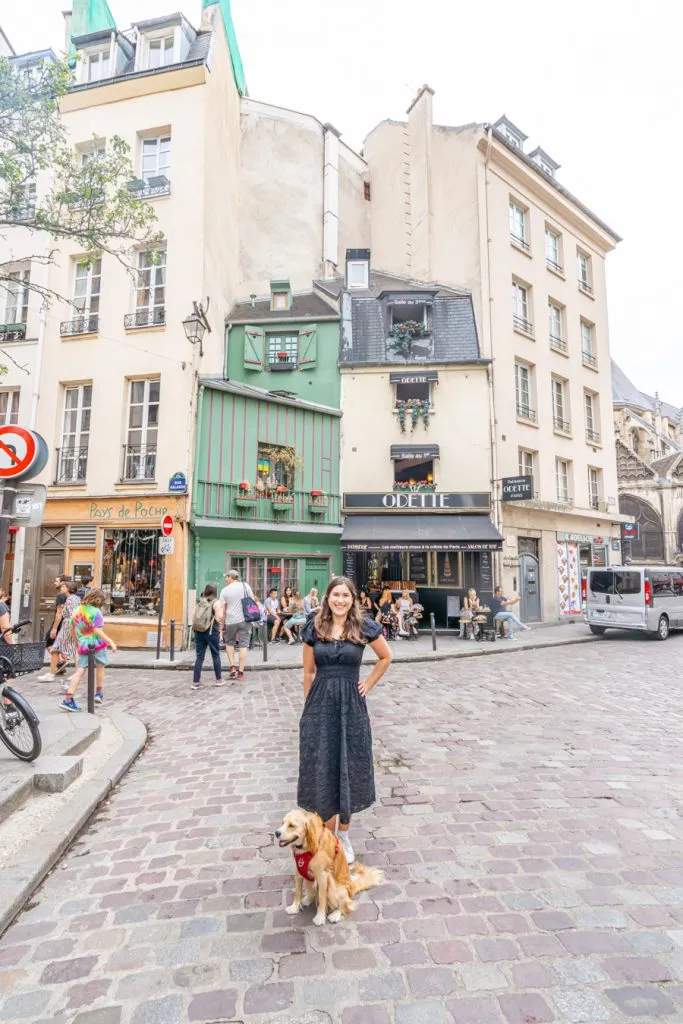 kate storm and ranger storm standing in front of odette paris cafe, a fun stop when traveling to paris for the first time