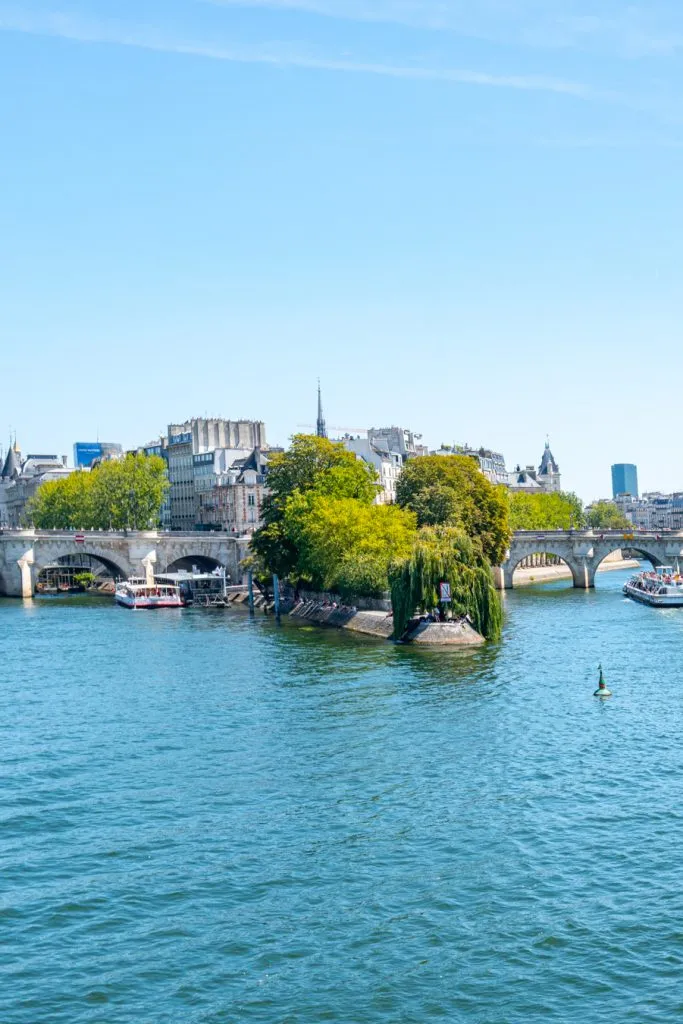 view of il de la cite from pont des arts during summer in paris planning a trip