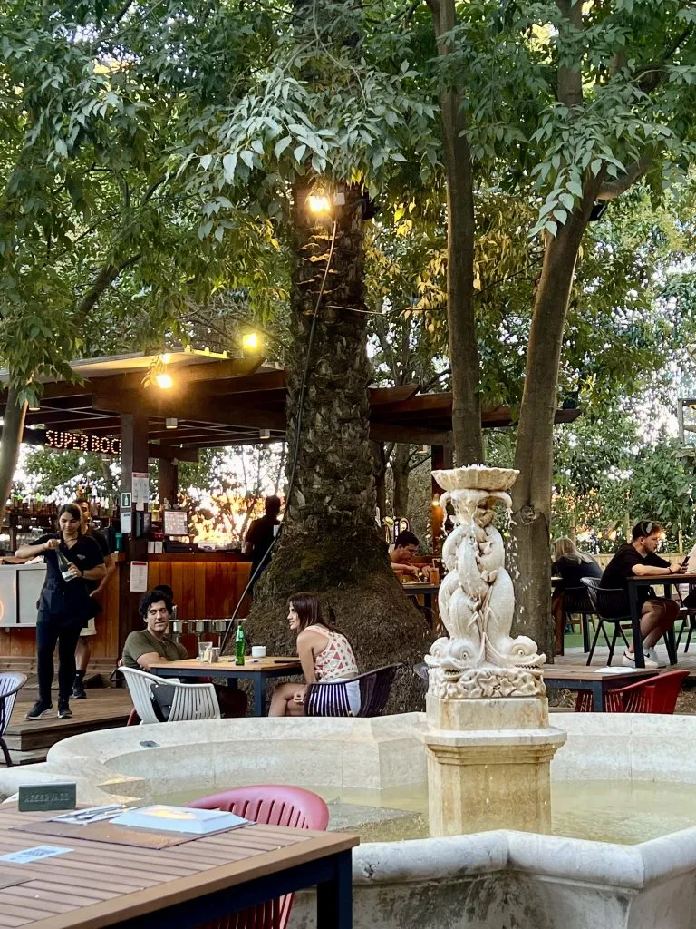 back garden of atalho real restaurant principe real with a fountain in the foreground