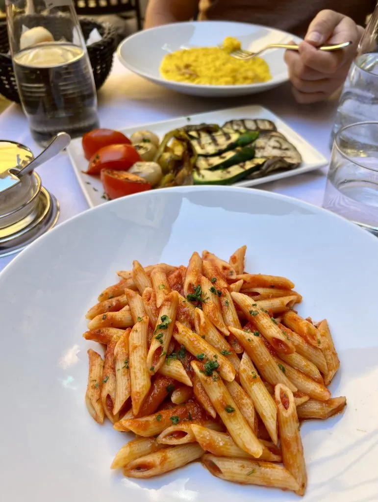 pasta and risotto on the table at bellagio restaurant Antico Pozzo Ristorante