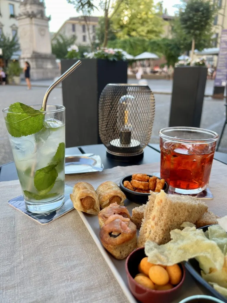 aperitivo spread at a cocktail bar in como, as enjoyed when dining in italy