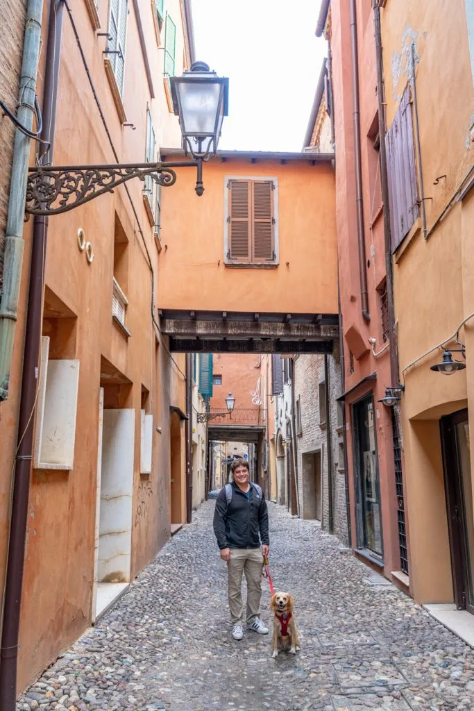 jeremy storm and ranger storm on a cobblestone street on an itinerary emilia romagna visit ferrara