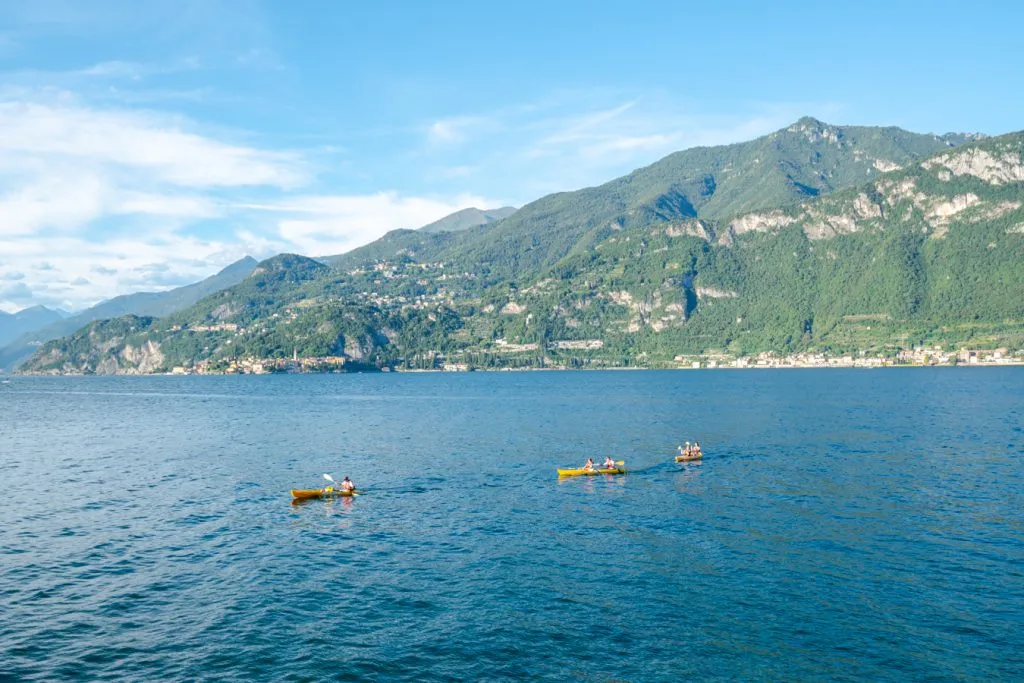 travelers in yellow kayaks o in bellagio lake como italy