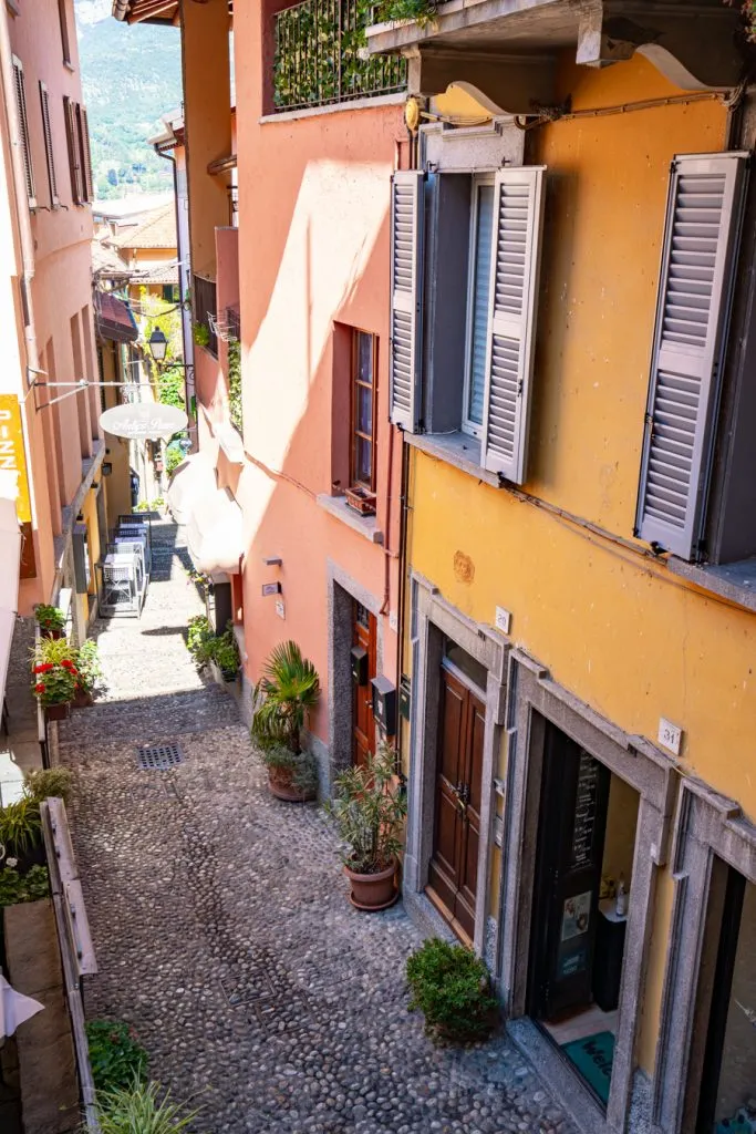 colorful buildings lining a stone street as seen during a visit bellagio italy
