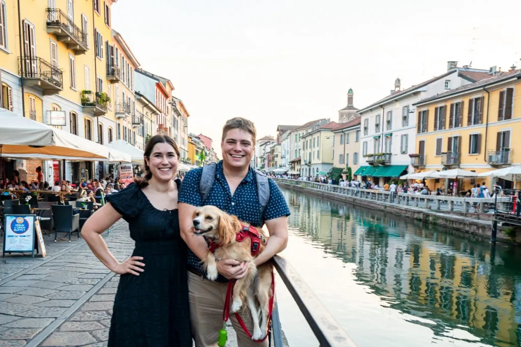 kate storm jeremy storm and ranger storm standing in front of a canal during one day in milan italy