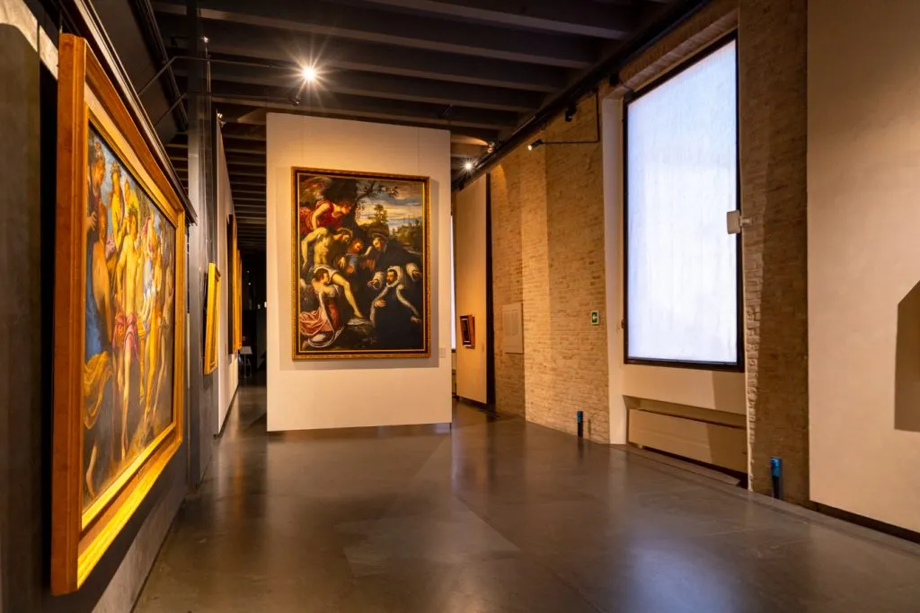 gallery lined with paintings at national gallery parma things to do