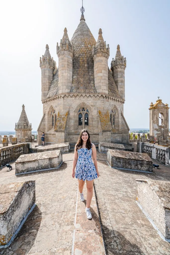 kate storm standing on the rooftop of the evora cathedral, one of the best things to do in evora portugal