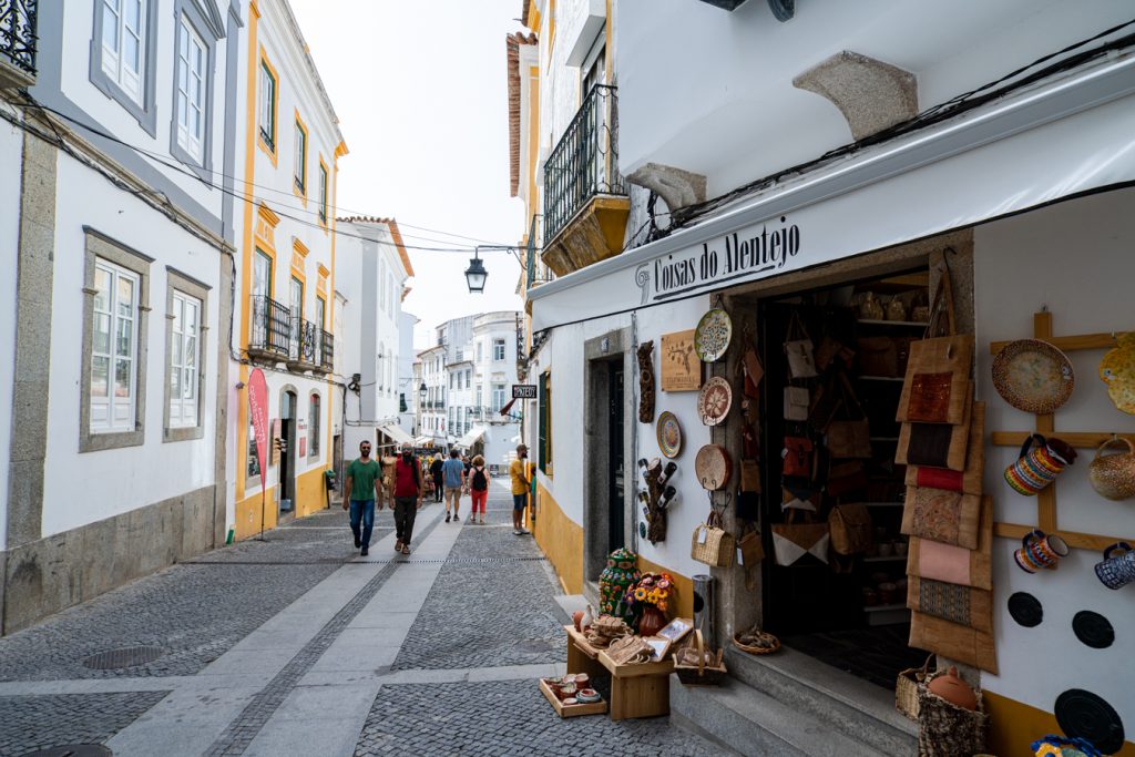 rua cinco de outubro shopping street with souvenirs evora portugal
