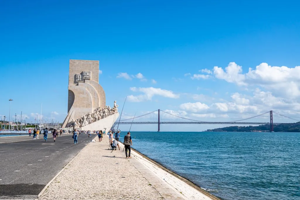 monument of the discoveries as seen from afar with tagus river to the left