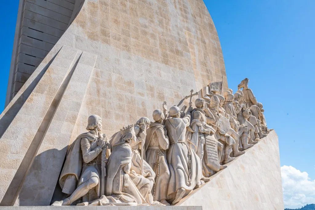 close up of the statues on the monument of the discoveries in belem lisbon portugal