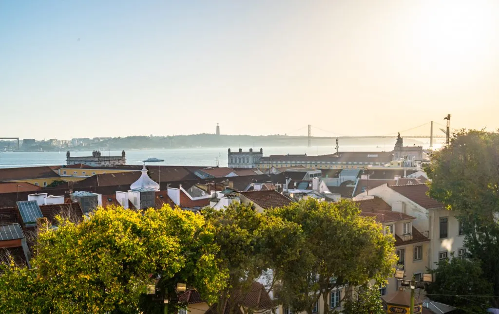 view of lisbon and tagus river from cathedral balcony at sunset