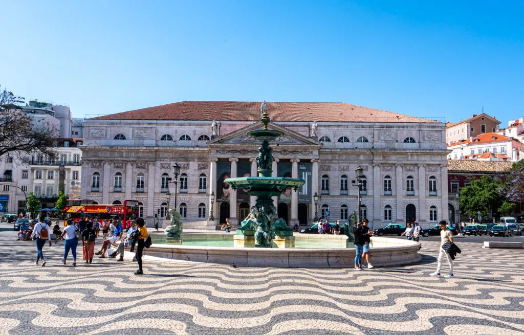 rossio square as seen when visiting lisbon portugal with calcada portuguesa in the foreground