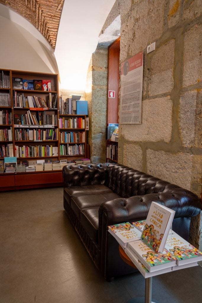 leather couch and collection of books in livraria bertrand lisbon