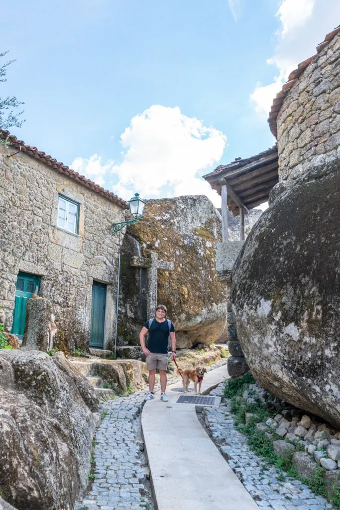 jeremy storm and ranger storm standing on a street amongst boulders monsanto portugal