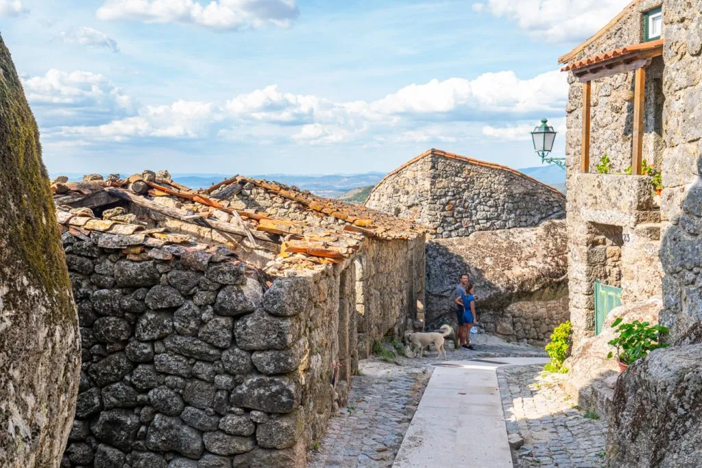small street lined with boulders and stone houses as seen when visiting monsanto
