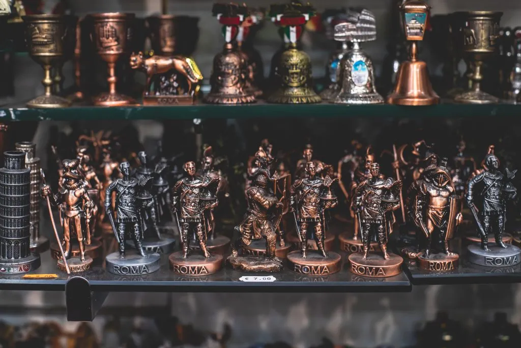 shelf of gladiator figurines for sale as souvenirs from rome