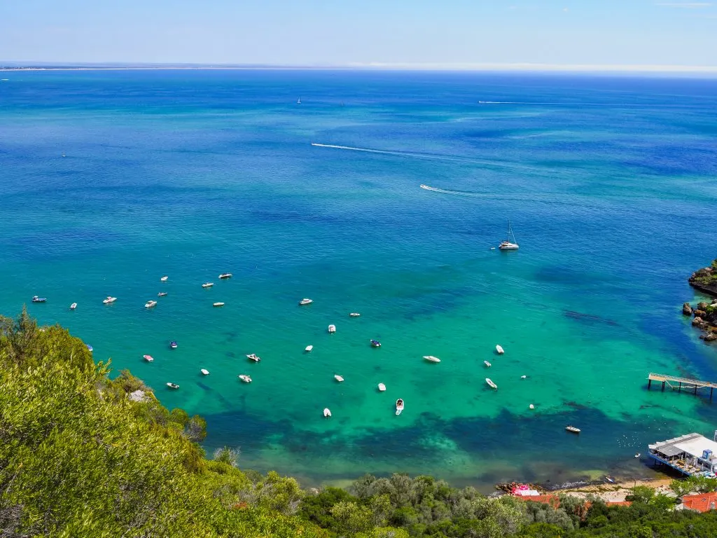praia do portinho da arrabida, one of the best beaches in portugal, as seen from above