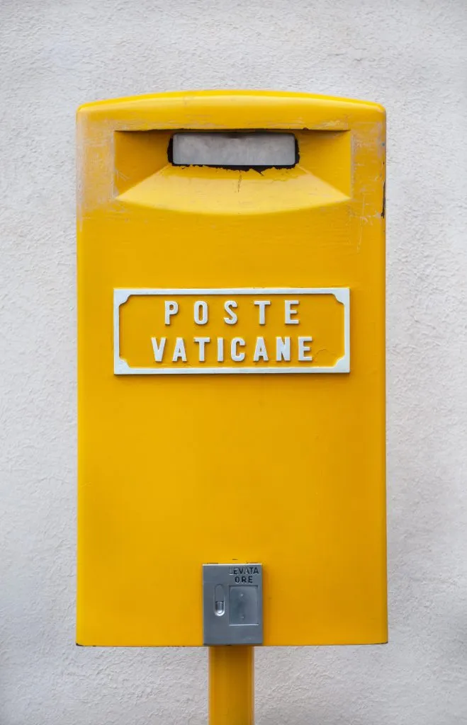 yellow vatican city mailbox, perfect for sending souvenirs from rome italy
