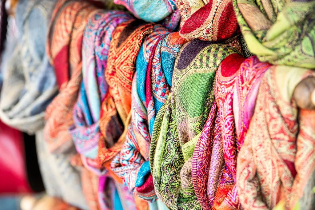 selection of silk scarves for sale, souvenir option when deciding what to buy in rome italy
